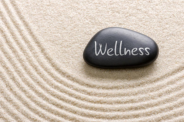 black-stone-with-the-inscription-wellness-picture-id497091318